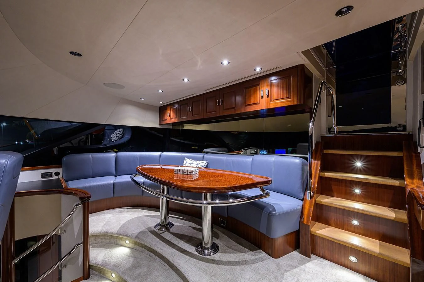 a room with a table and chairs aboard DETERMINATION Yacht for Sale
