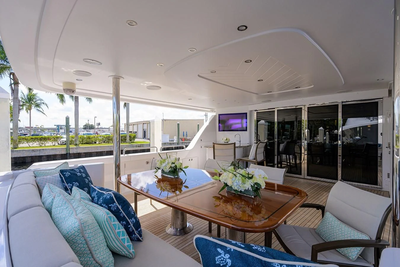 a large living room with a table and chairs aboard DETERMINATION Yacht for Sale