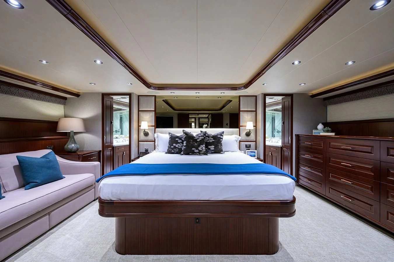 a bedroom with a bed and a desk aboard DETERMINATION Yacht for Sale