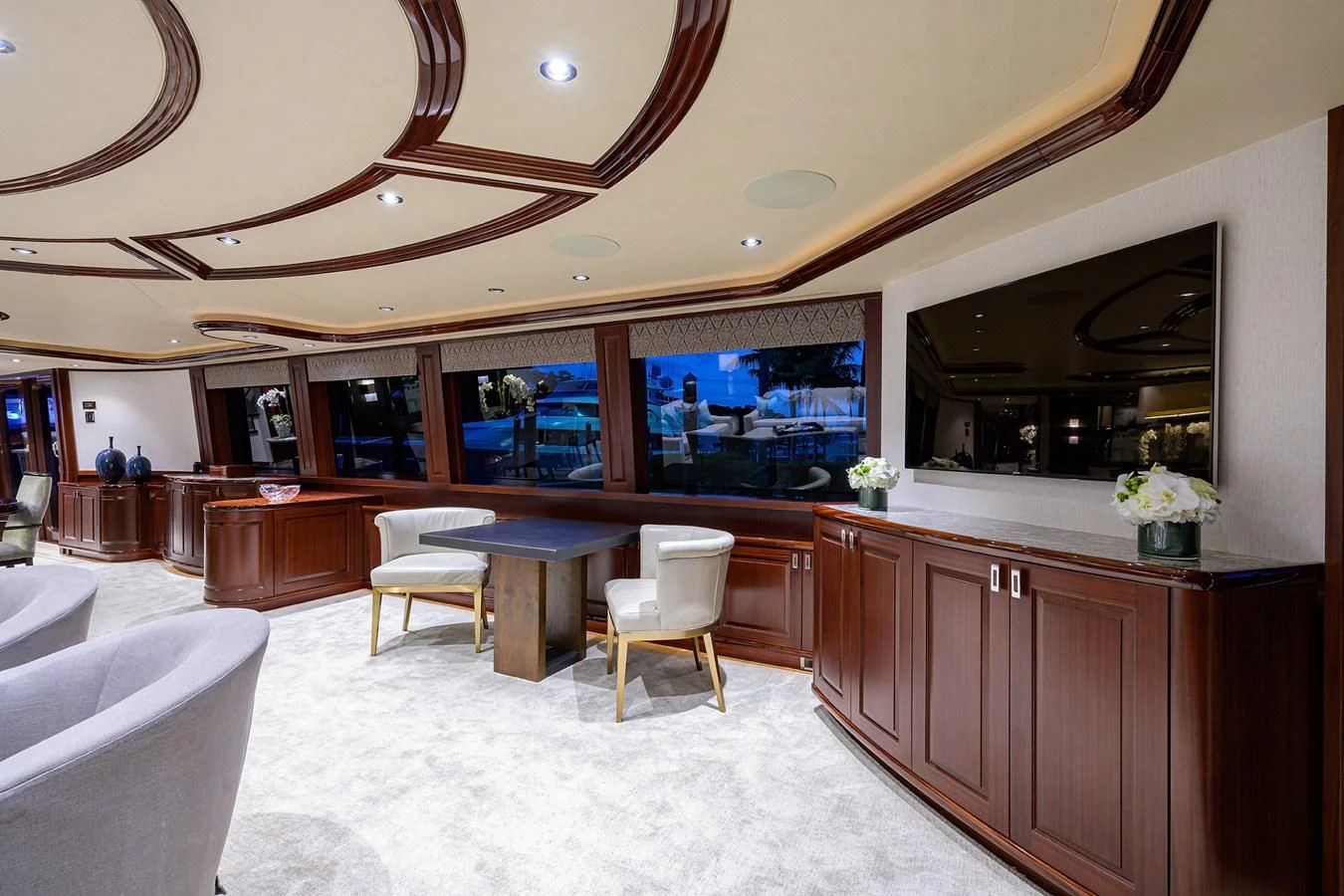 a large kitchen with a table and chairs aboard DETERMINATION Yacht for Sale