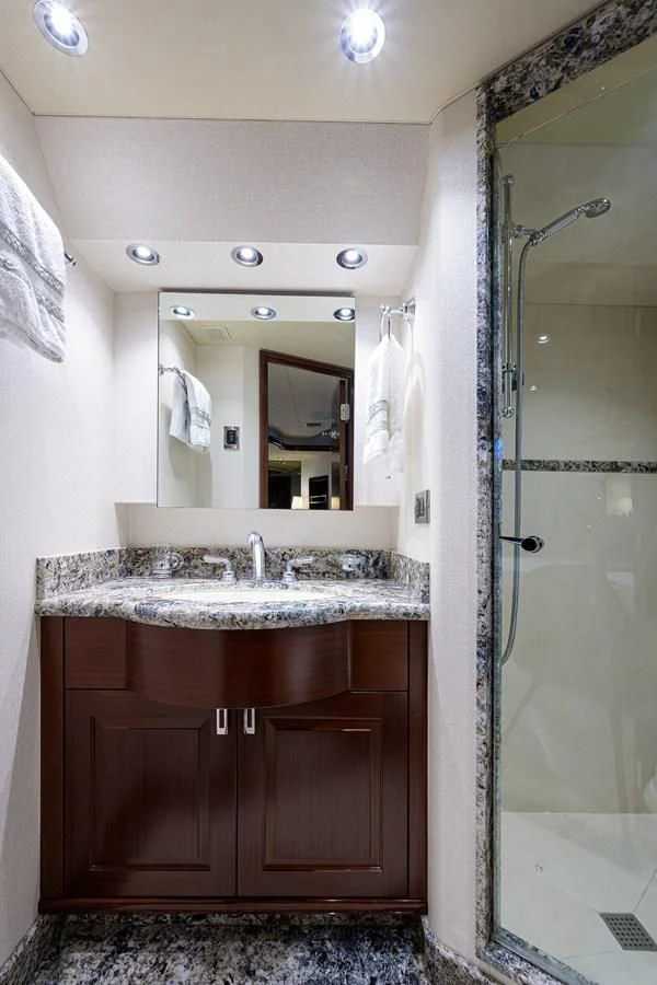 a bathroom with a sink and a shower aboard DETERMINATION Yacht for Sale
