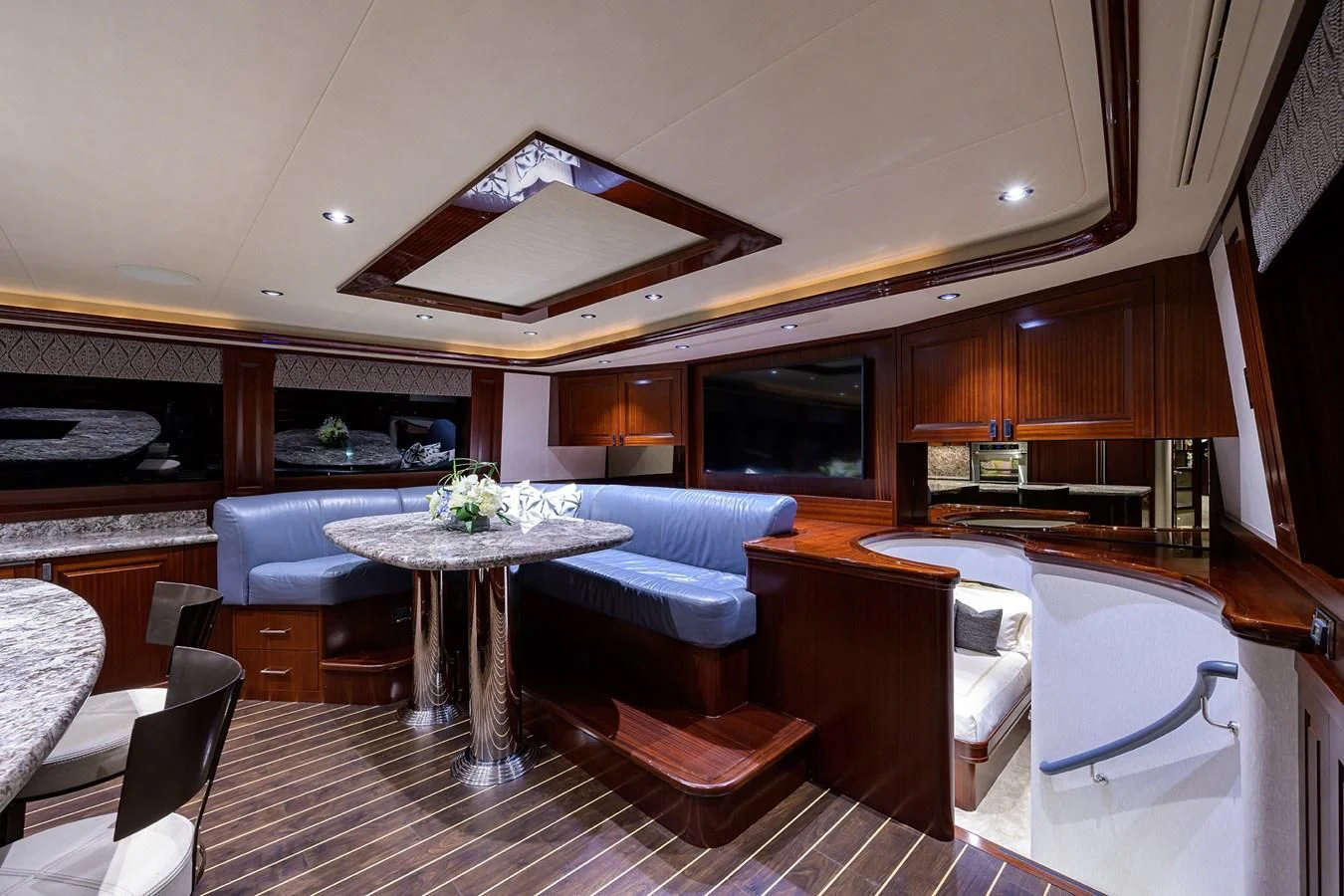 a room with a table and chairs aboard DETERMINATION Yacht for Sale