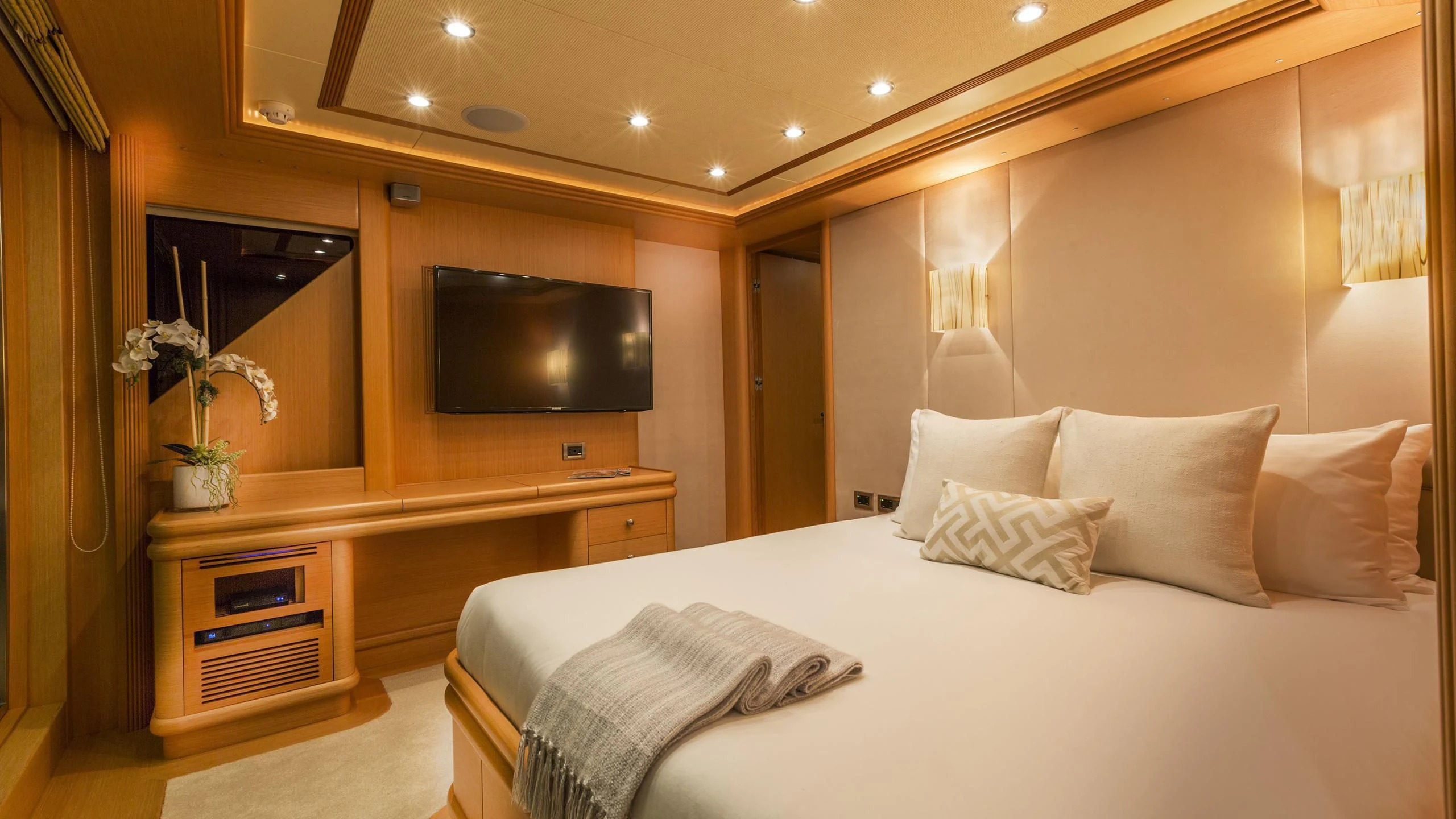 a bed with white sheets and pillows aboard DEDE Yacht for Sale