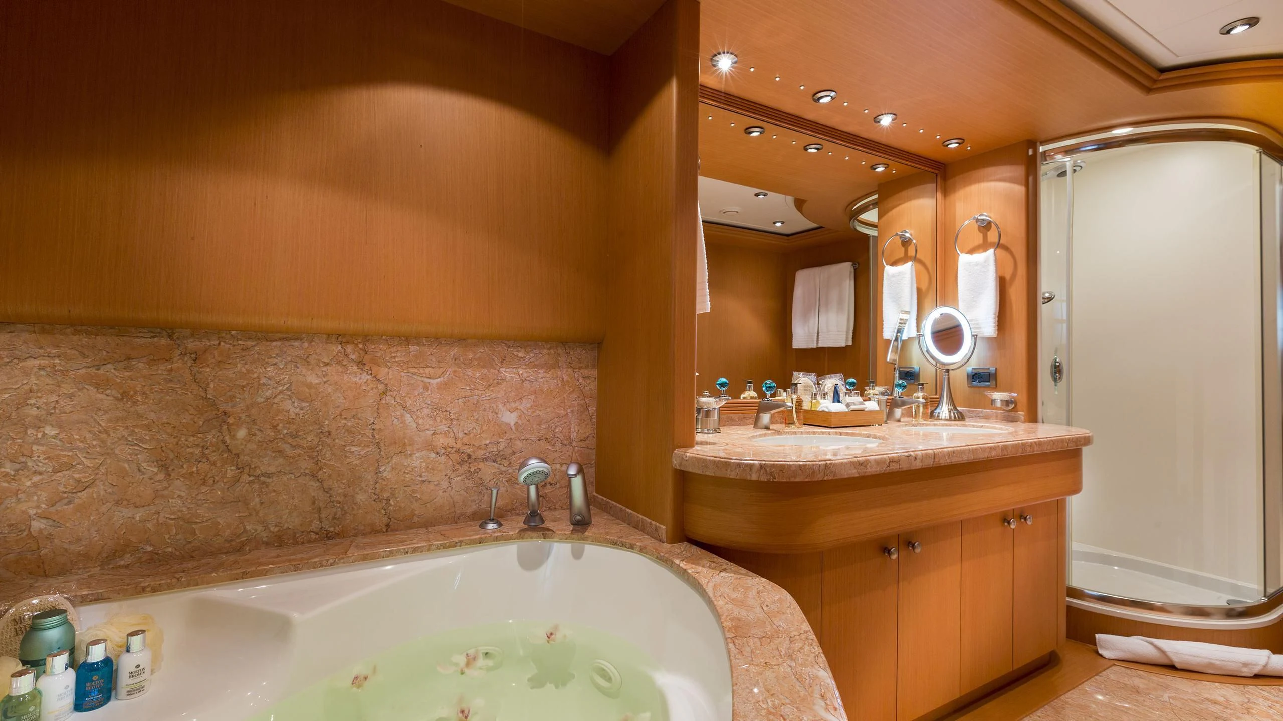 a bathroom with a bathtub and a sink aboard DEDE Yacht for Sale