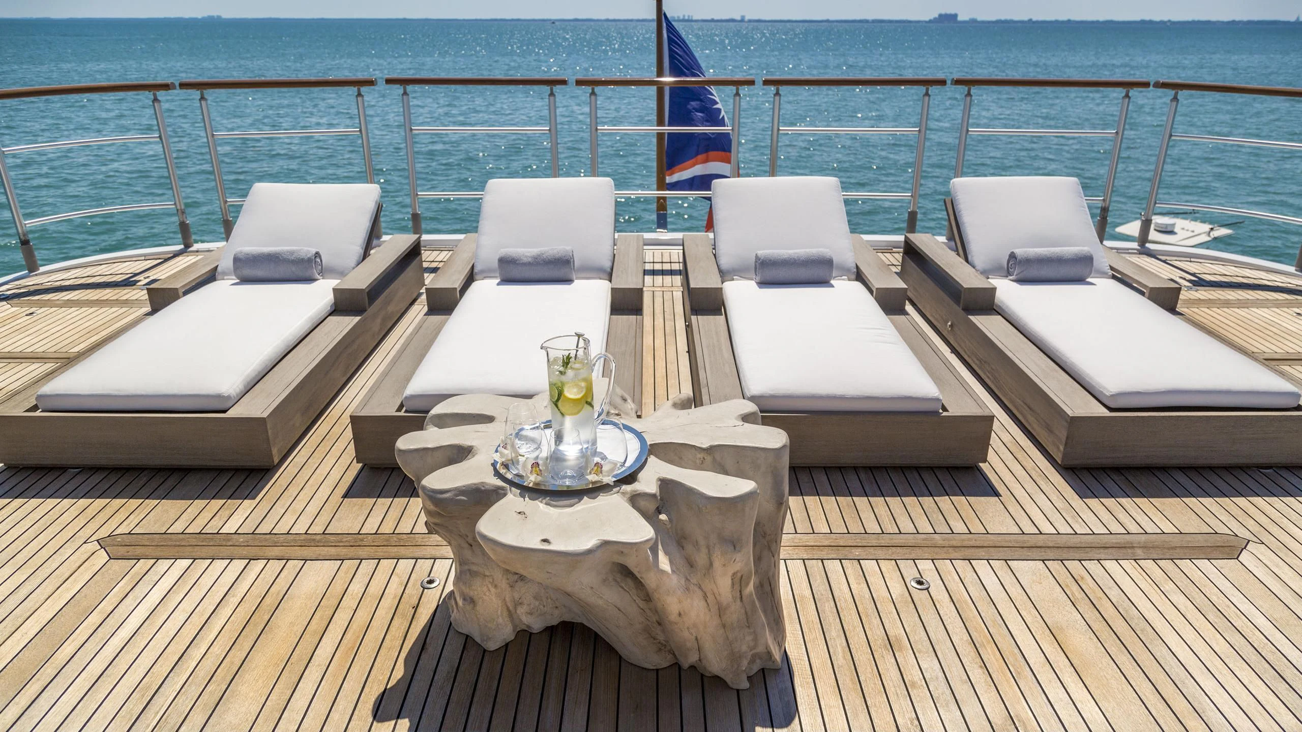 a table with chairs and a tray on it aboard DEDE Yacht for Sale