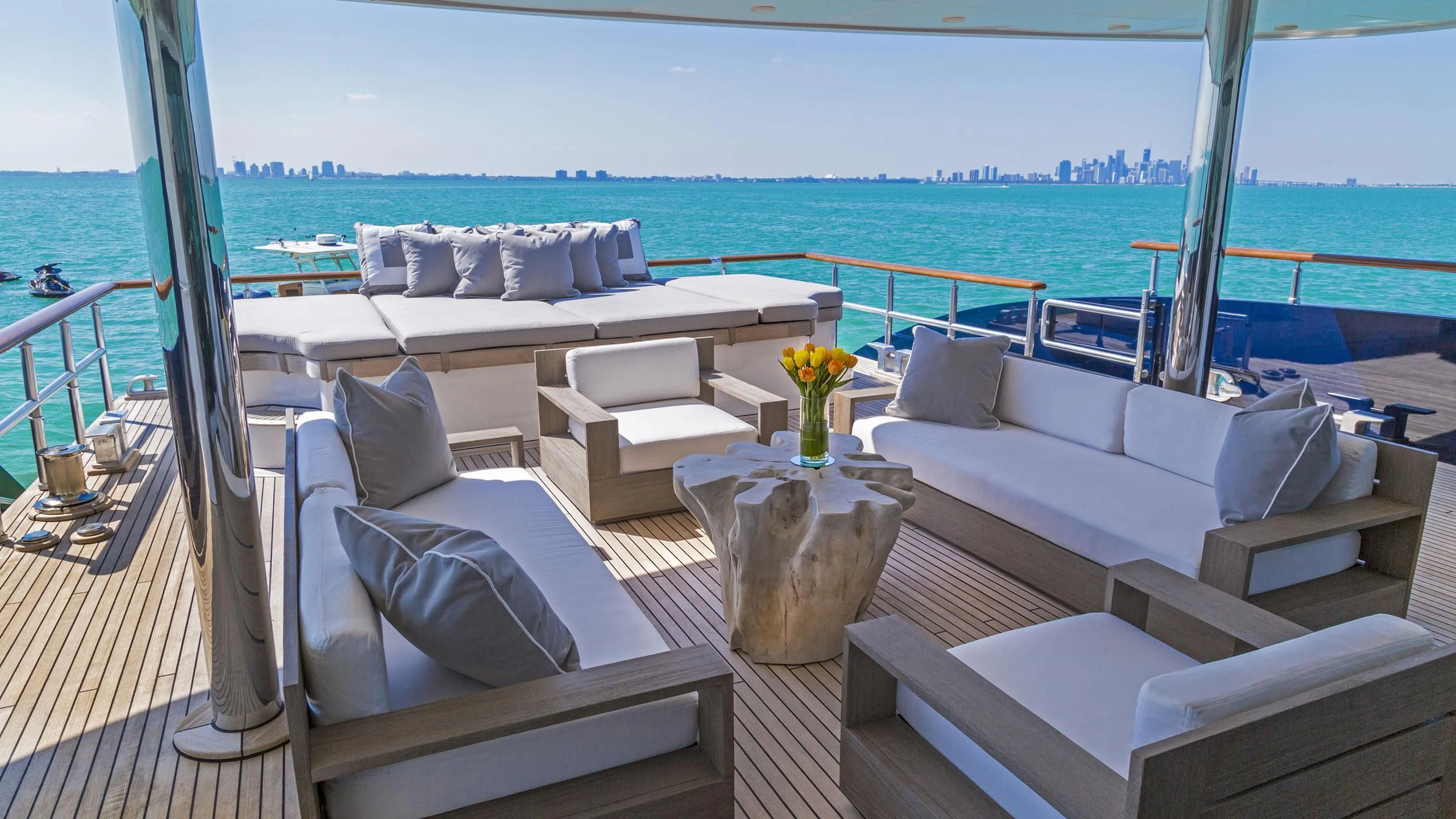 a room with a table chairs and a view of the ocean aboard DEDE Yacht for Sale