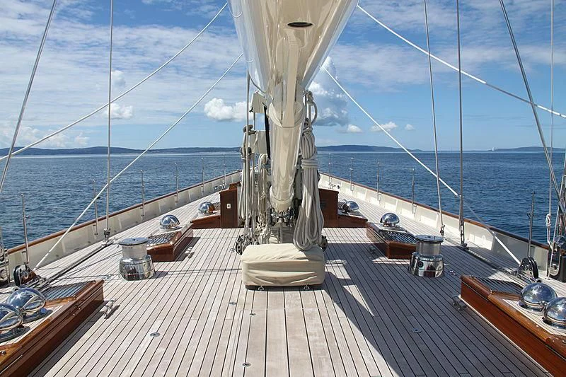 a deck with a large body of water and a large ship in the distance aboard KAMAXITHA Yacht for Sale