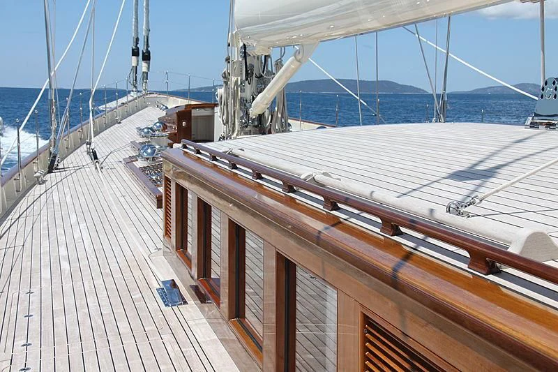 a deck with a deck and a boat on it aboard KAMAXITHA Yacht for Sale