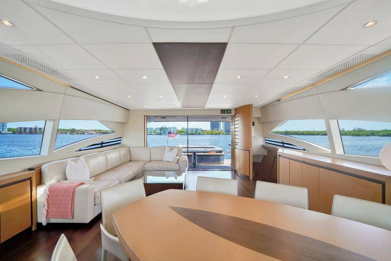 a room with a table and chairs aboard JERICO V Yacht for Sale