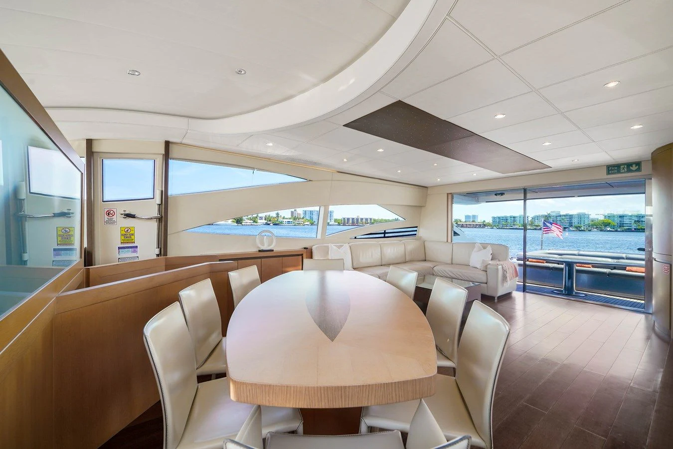 a room with a table and chairs aboard JERICO V Yacht for Sale