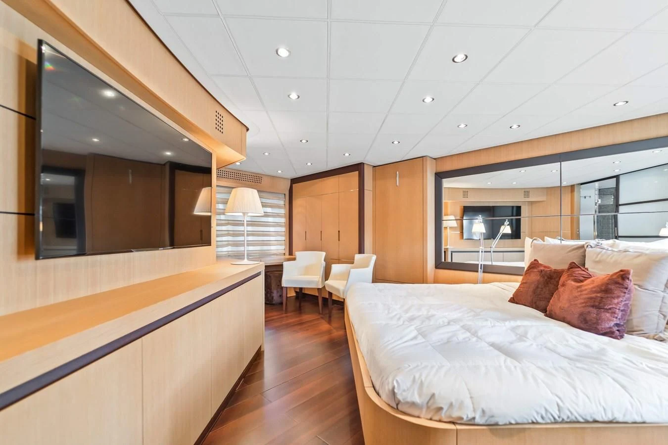 a room with a bed and a desk aboard JERICO V Yacht for Sale