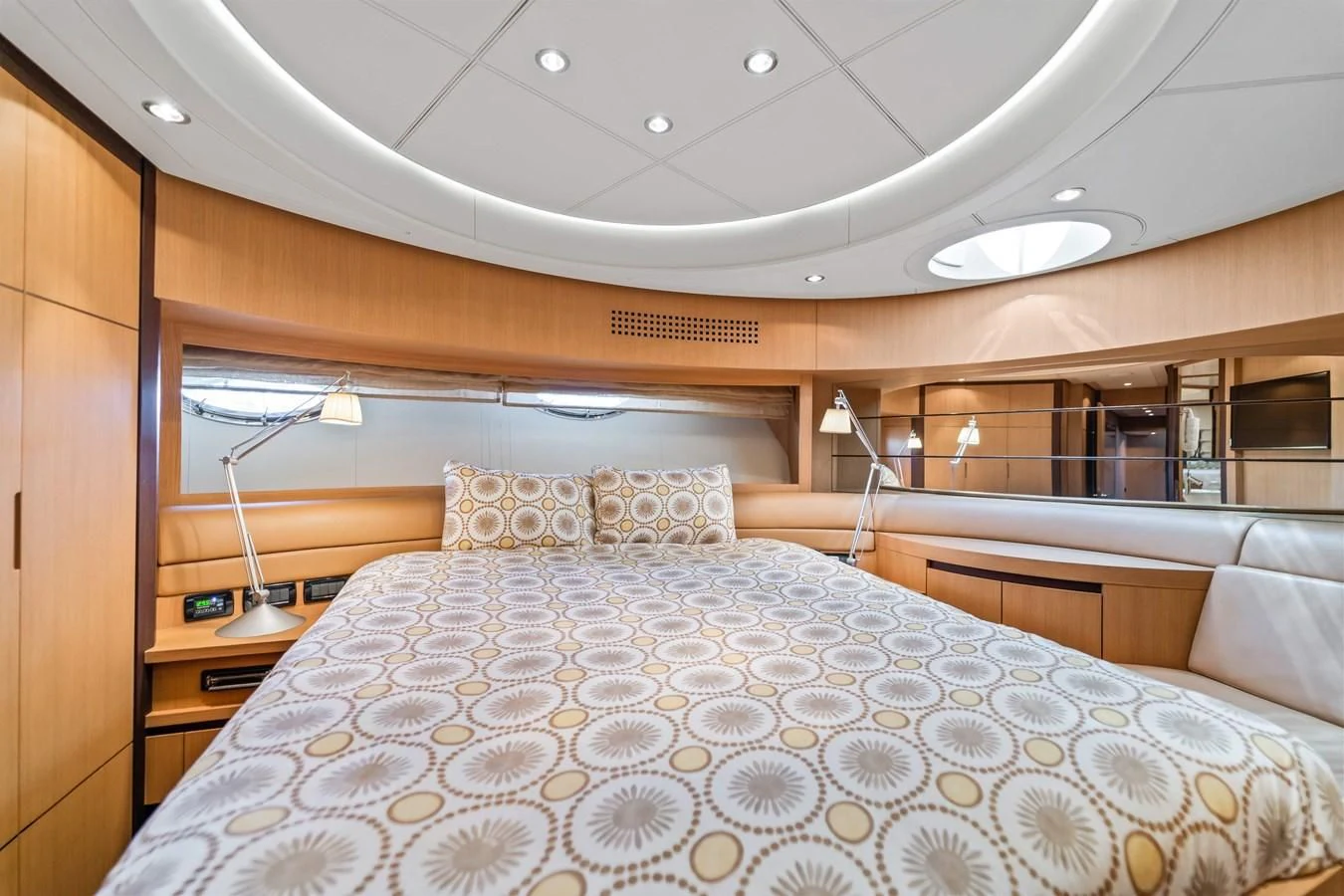 a bed with a white comforter aboard JERICO V Yacht for Sale