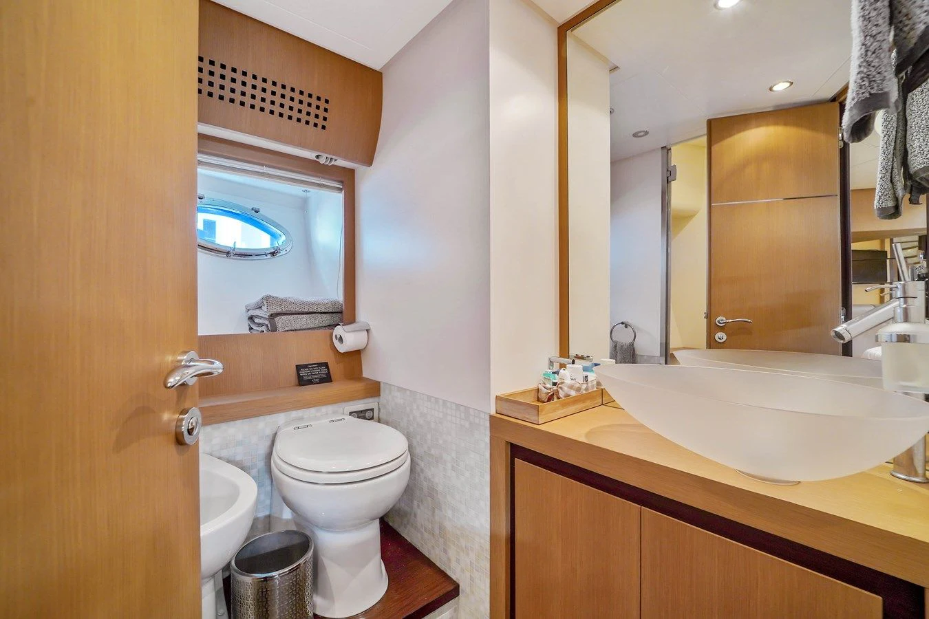 a bathroom with a sink and a toilet aboard JERICO V Yacht for Sale