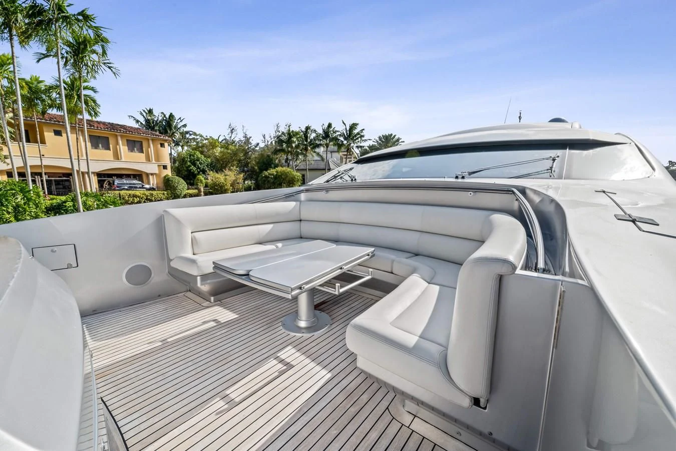 a white car with a white roof aboard JERICO V Yacht for Sale