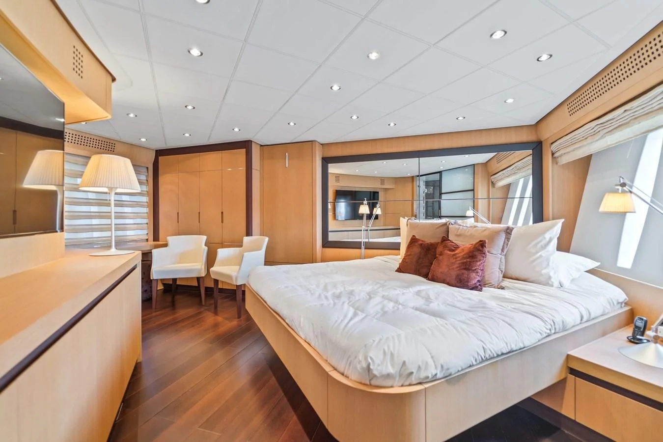 a large bedroom with a large bed aboard JERICO V Yacht for Sale