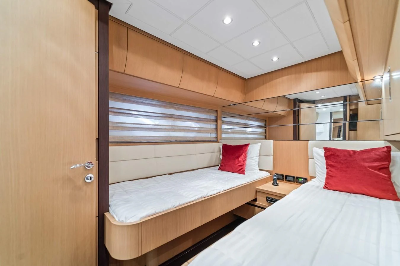 a room with two beds aboard JERICO V Yacht for Sale