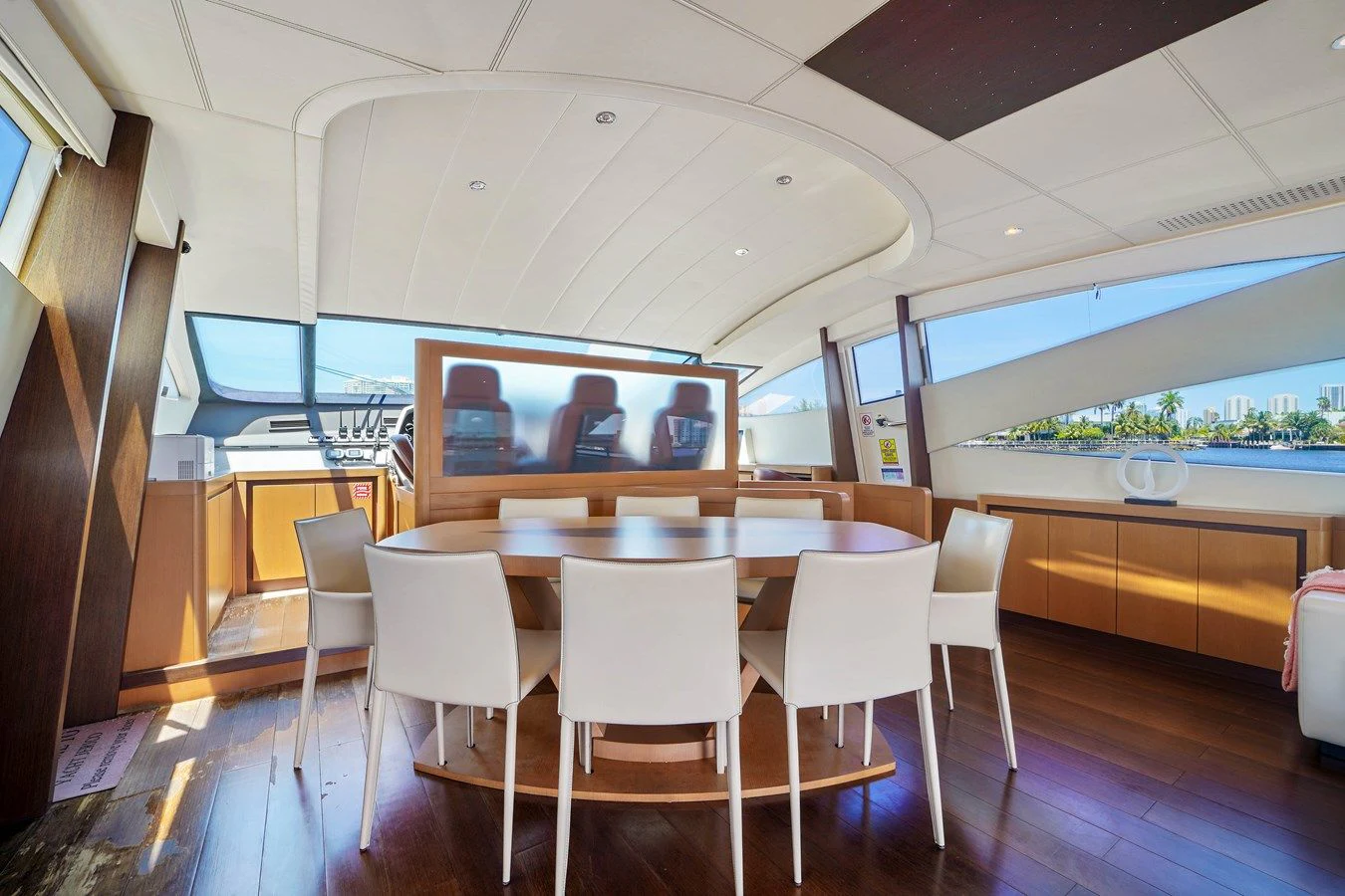 a room with tables and chairs aboard JERICO V Yacht for Sale