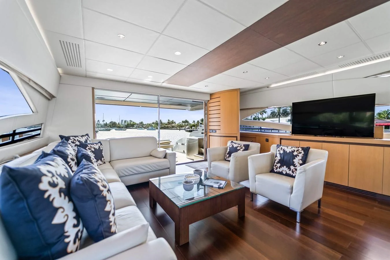 a living room with a large screen aboard JERICO V Yacht for Sale