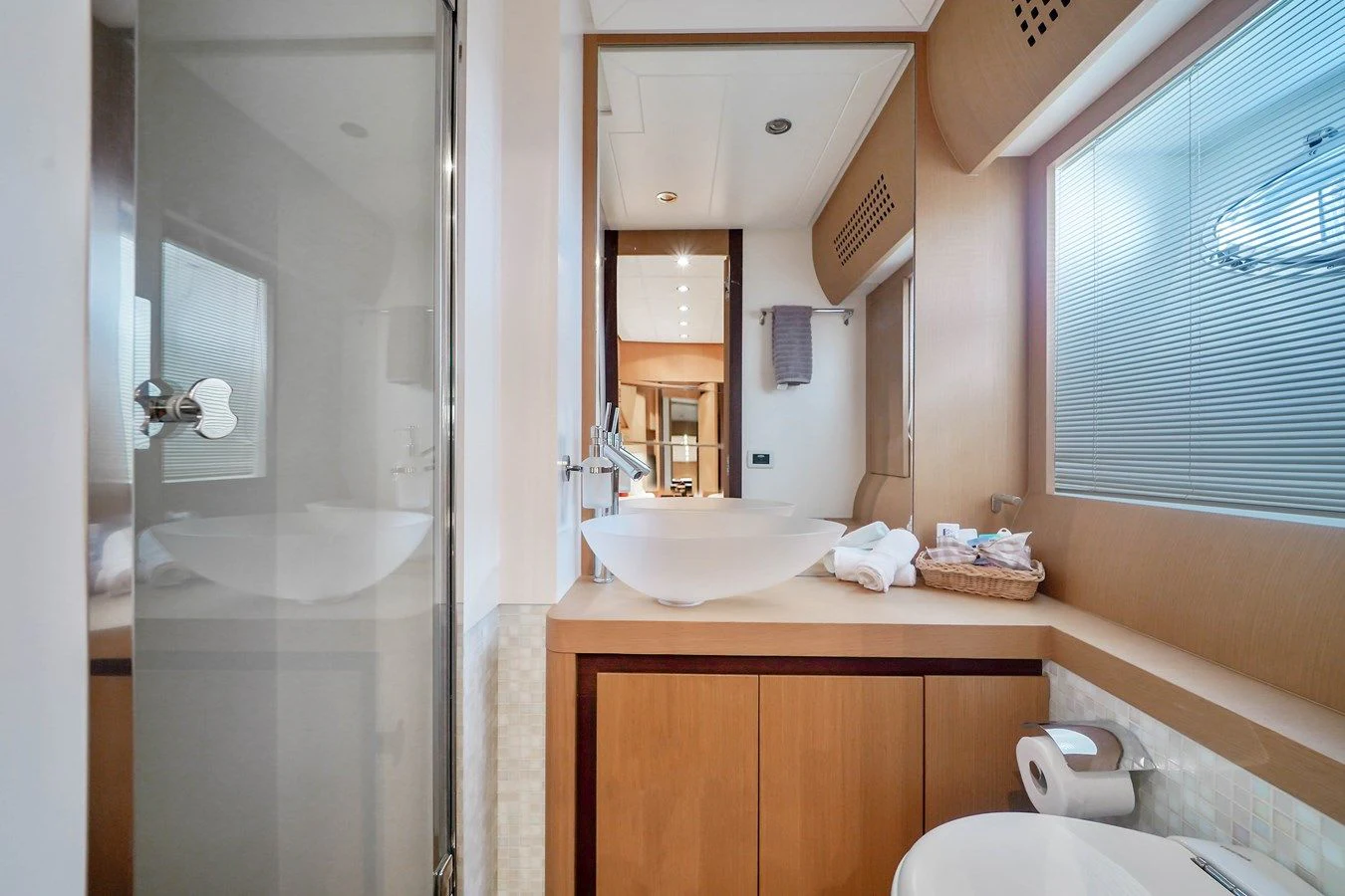 a bathroom with a sink and a mirror aboard JERICO V Yacht for Sale