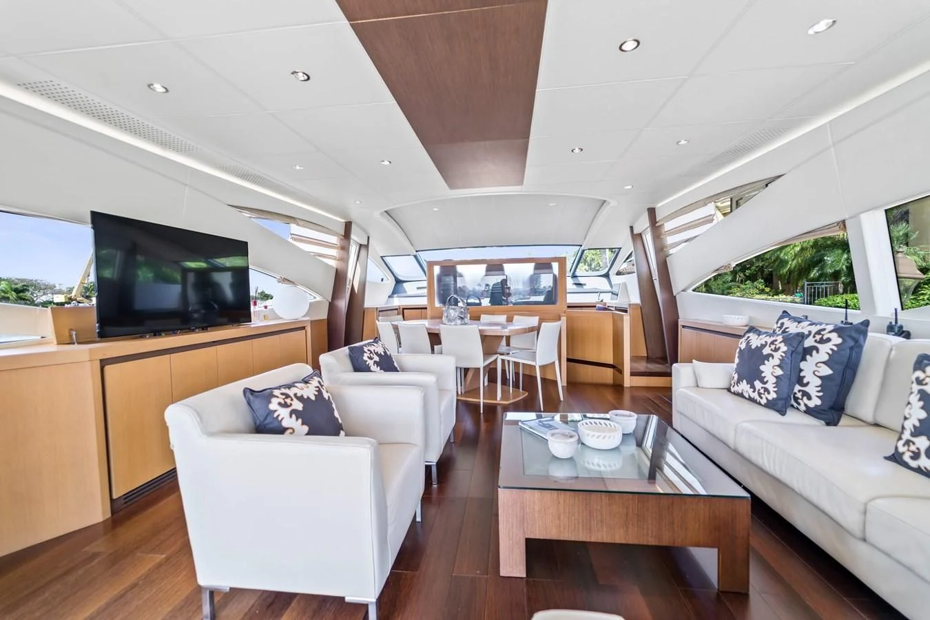 a living room with a couch and a television aboard JERICO V Yacht for Sale
