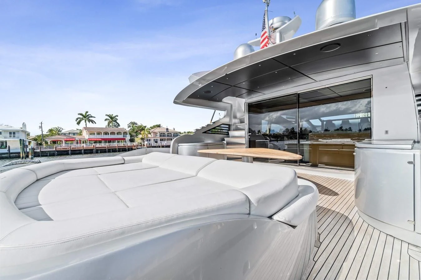a large white building with a large glass roof and a flag on top aboard JERICO V Yacht for Sale