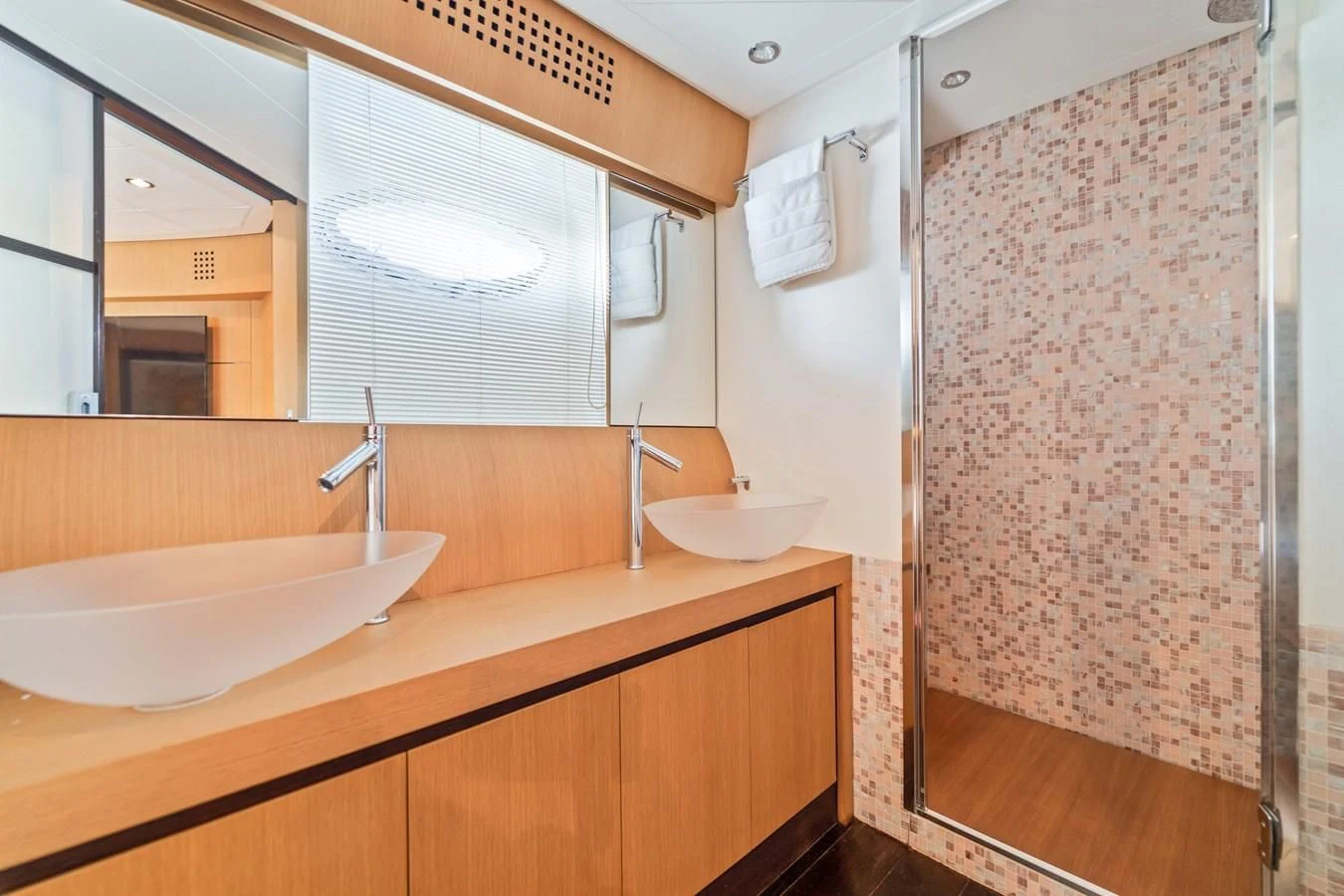 a bathroom with a sink and a shower aboard JERICO V Yacht for Sale