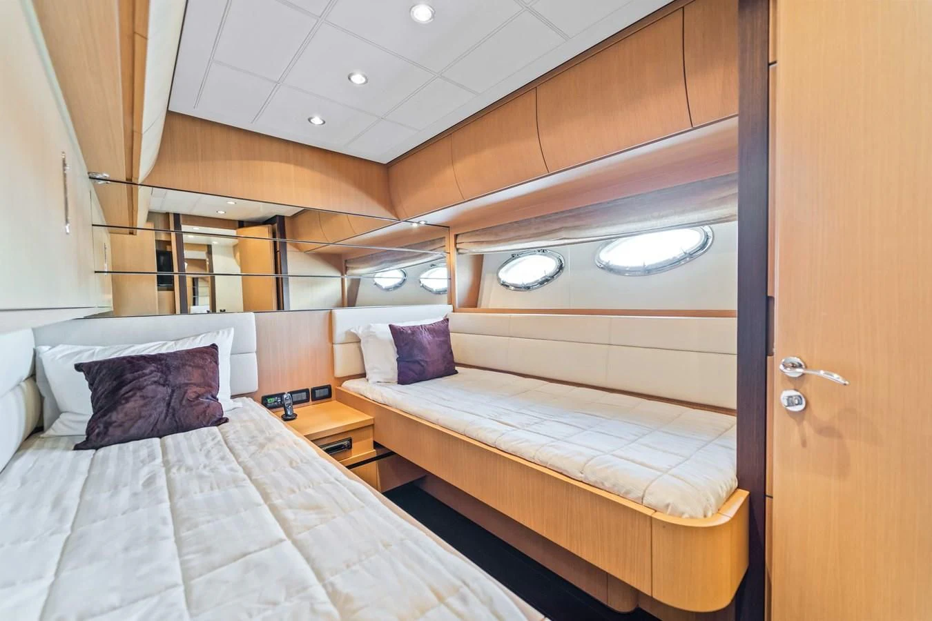 a room with two beds aboard JERICO V Yacht for Sale