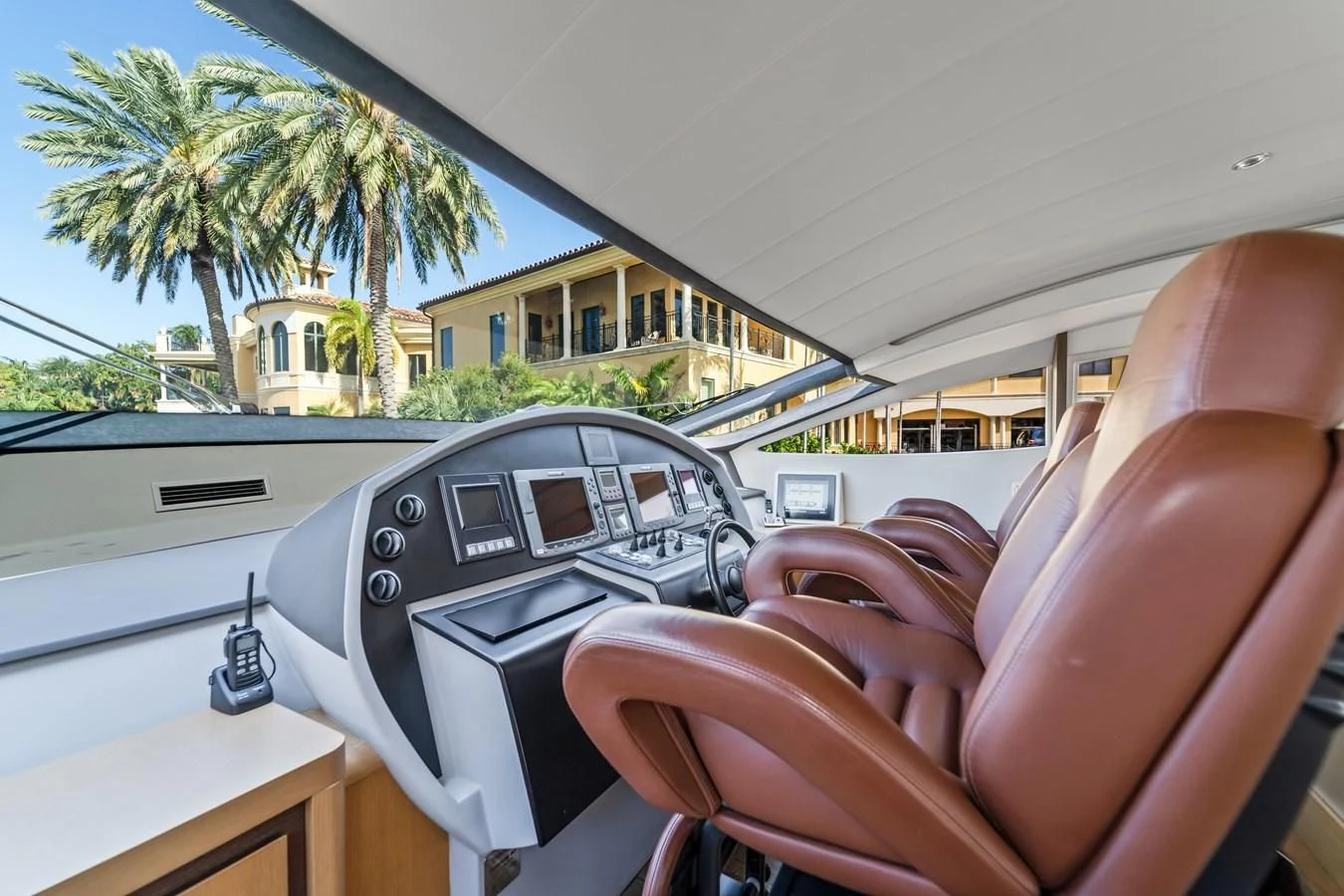 a hand holding a steering wheel aboard JERICO V Yacht for Sale
