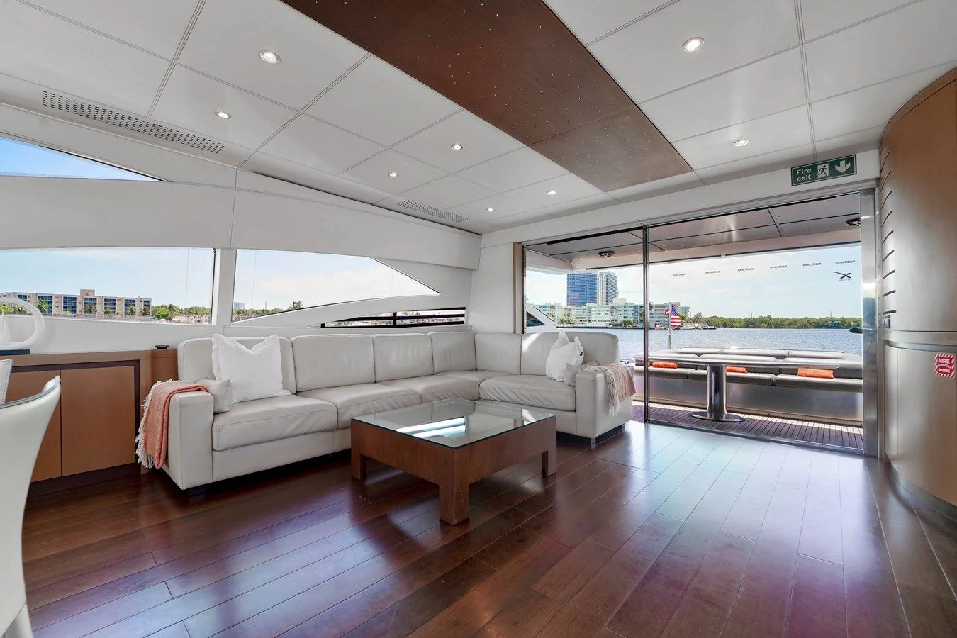 a living room with a wood floor aboard JERICO V Yacht for Sale