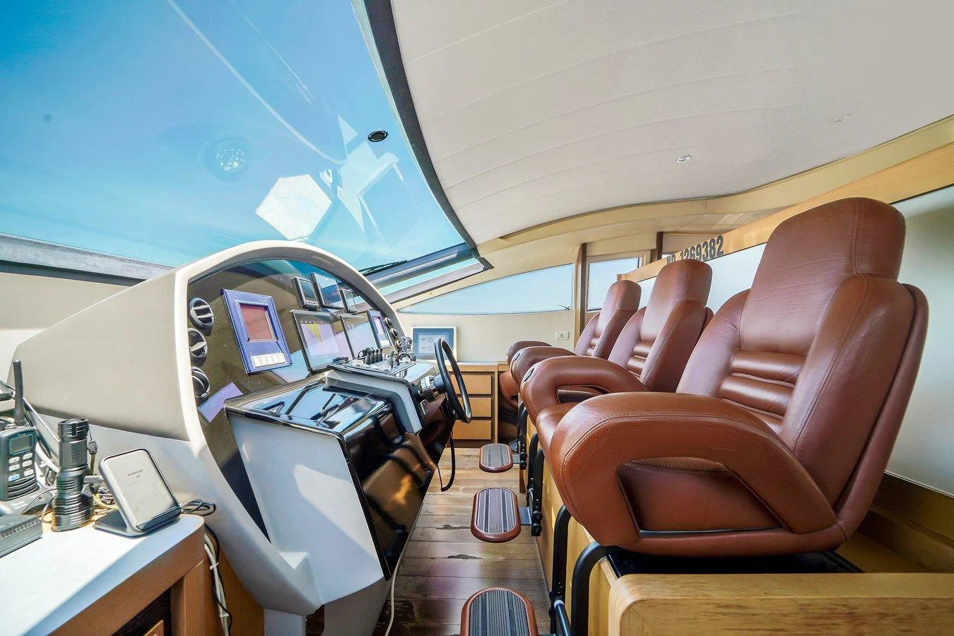 a room with a chair and a desk with a computer on it aboard JERICO V Yacht for Sale