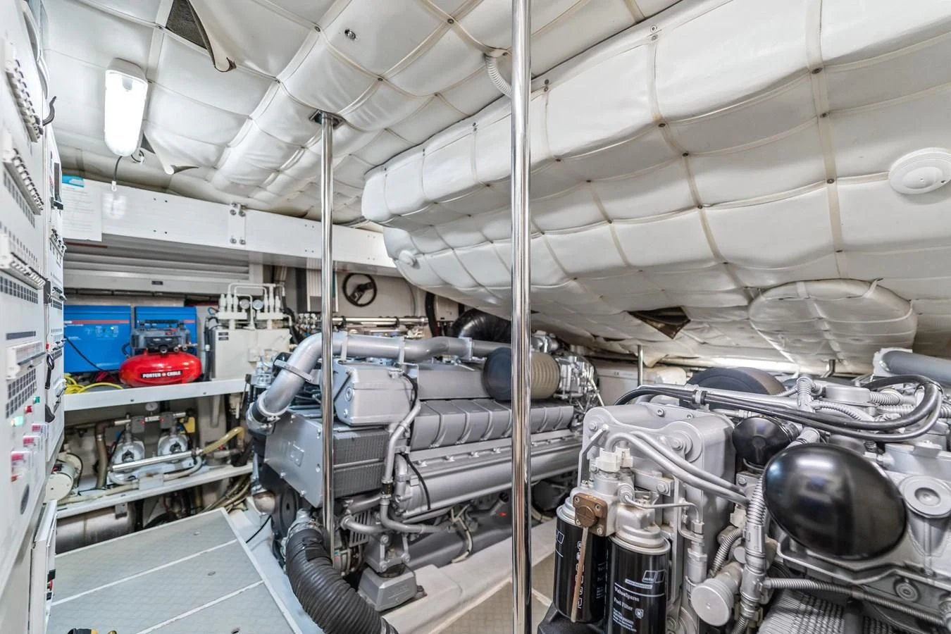 a room with a large group of pipes and machinery aboard JERICO V Yacht for Sale