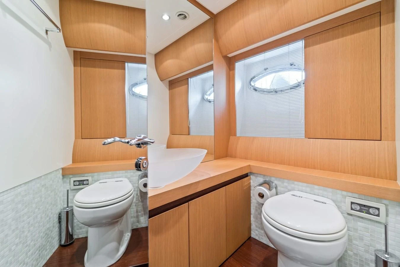 a bathroom with a toilet and sink aboard JERICO V Yacht for Sale