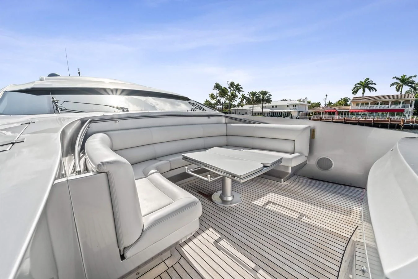 a white car with a white interior aboard JERICO V Yacht for Sale