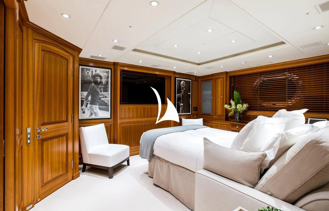 a room with a bed and a chair aboard PERSEUS Yacht for Sale