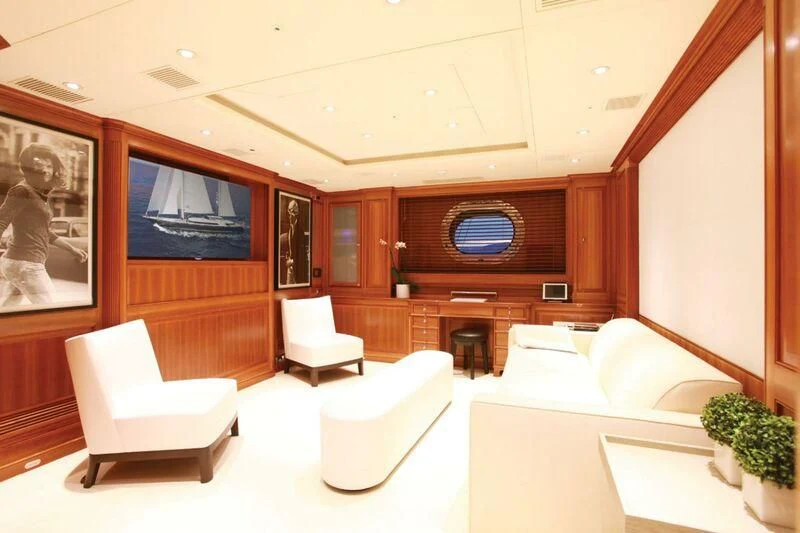 a room with couches and a tv aboard PERSEUS Yacht for Sale