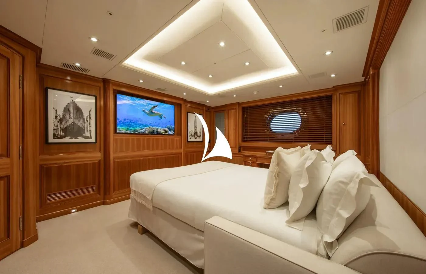 a room with a bed and a television aboard PERSEUS Yacht for Sale
