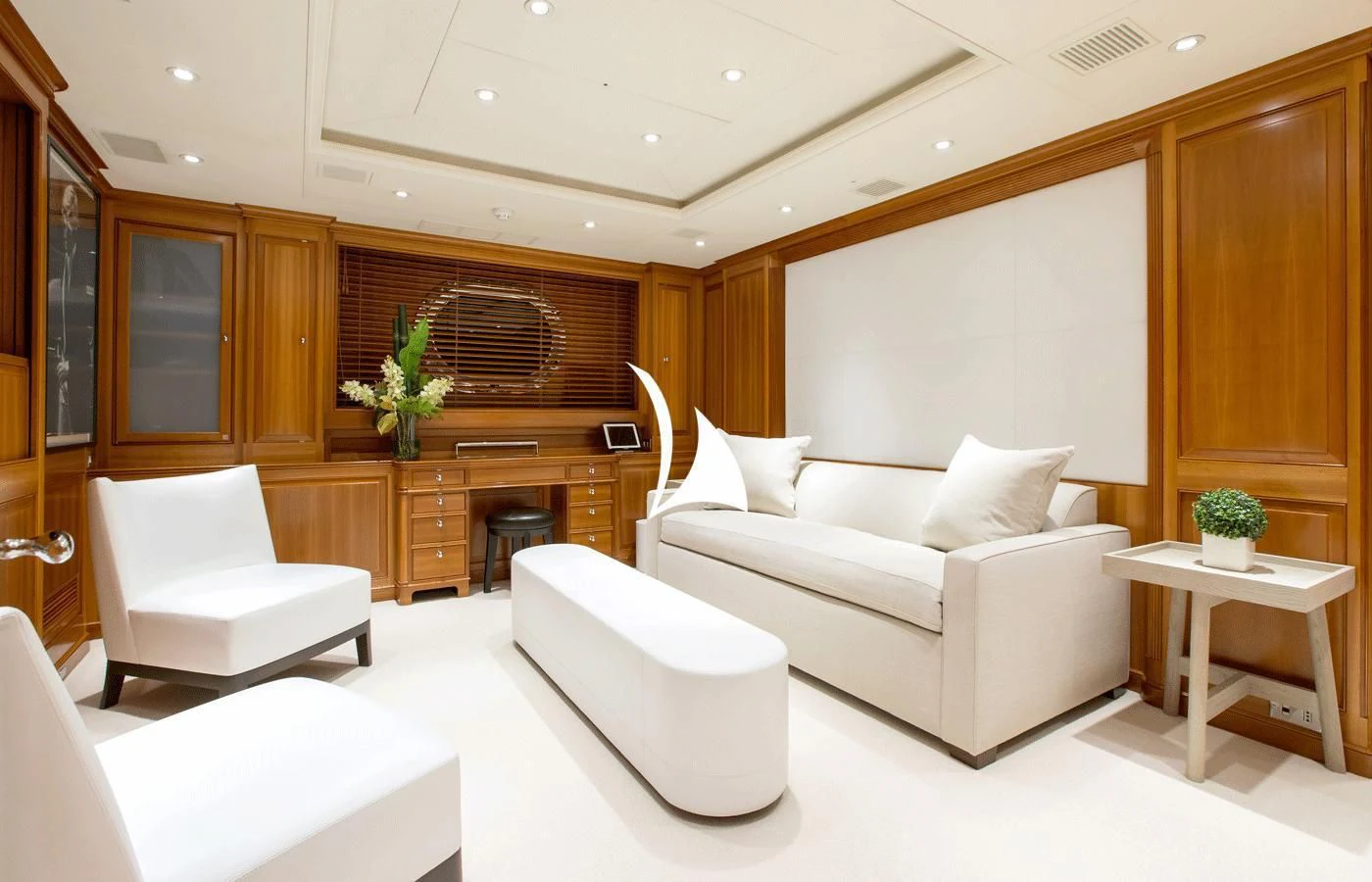 a room with a couch and a table aboard PERSEUS Yacht for Sale