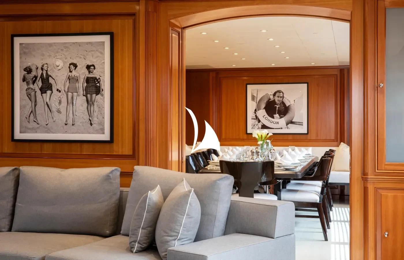 a living room with a couch and a coffee table aboard PERSEUS Yacht for Sale