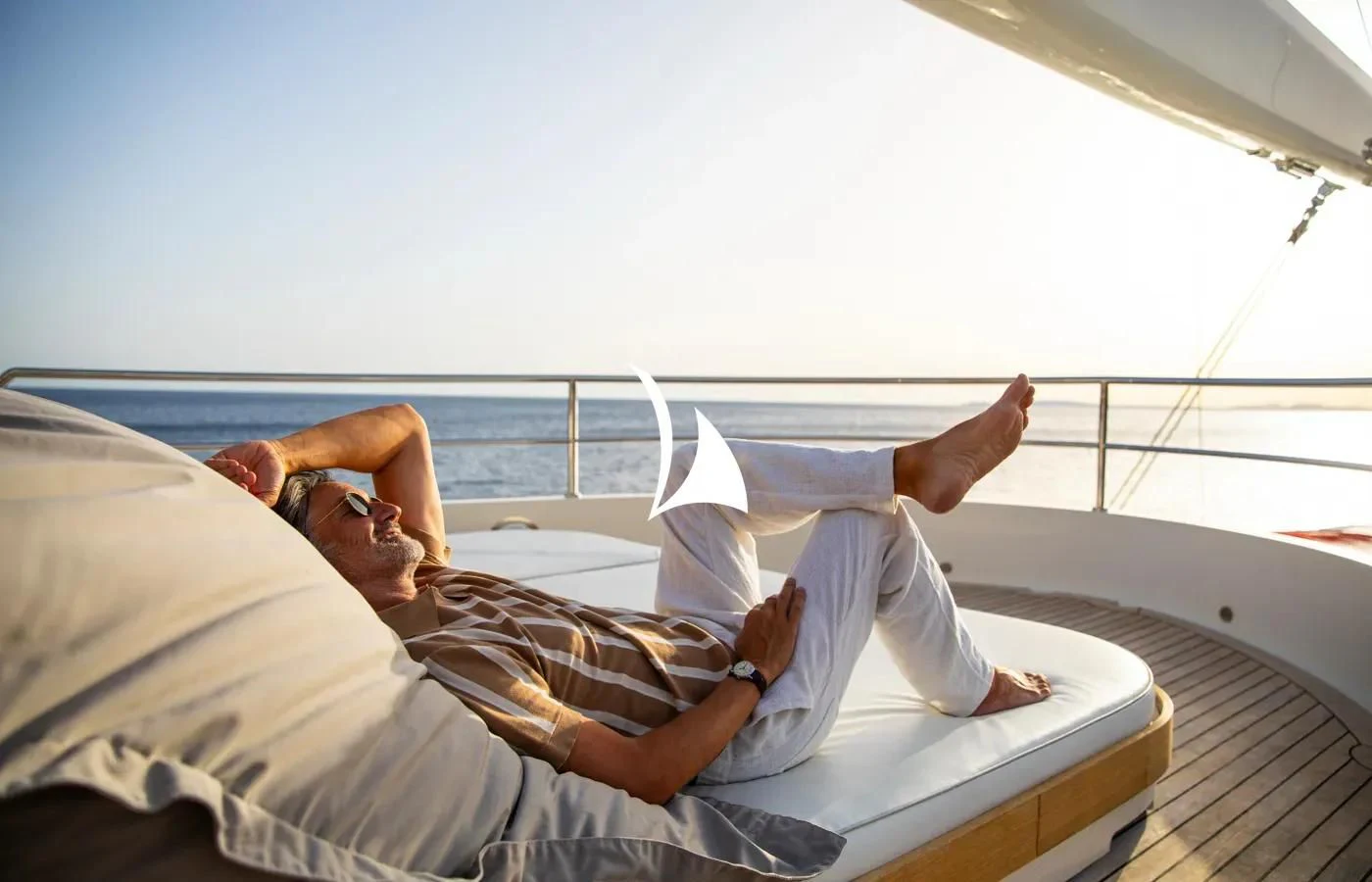 a person lying on a bed aboard PERSEUS Yacht for Sale