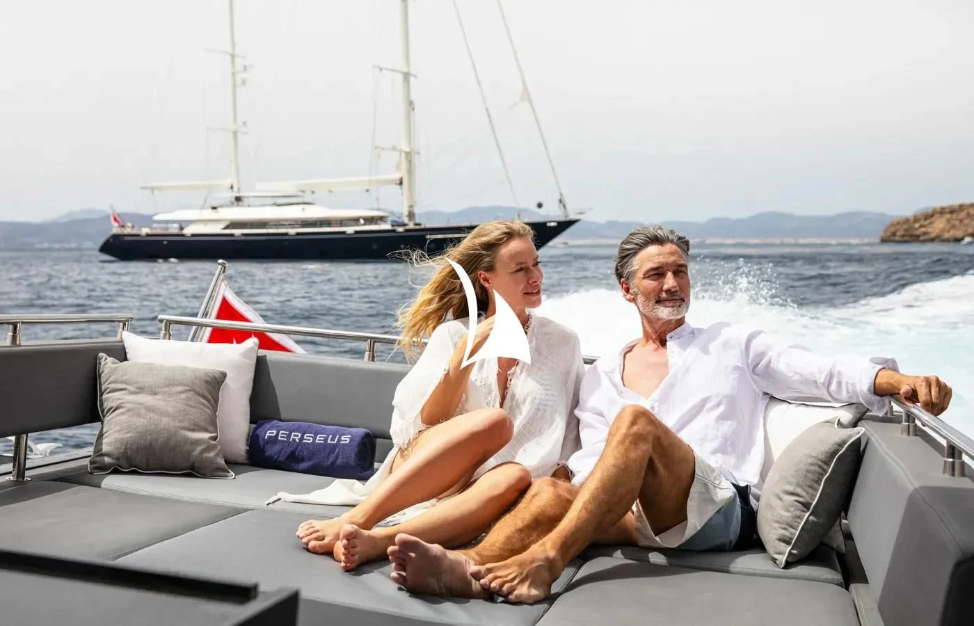 a man and woman sitting on a boat with a woman on the side aboard PERSEUS Yacht for Sale
