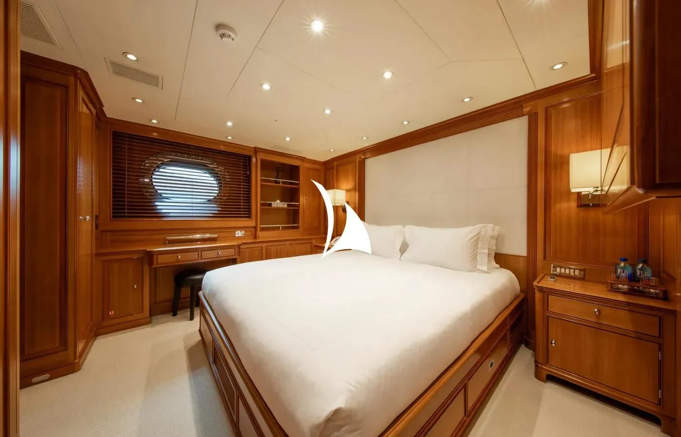 a room with a bed and a desk aboard PERSEUS Yacht for Sale