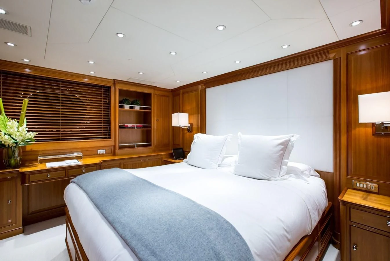 a bed with white sheets aboard PERSEUS Yacht for Sale