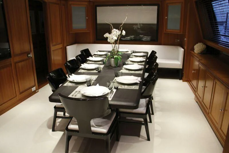 a dining room with a table and chairs aboard PERSEUS Yacht for Sale