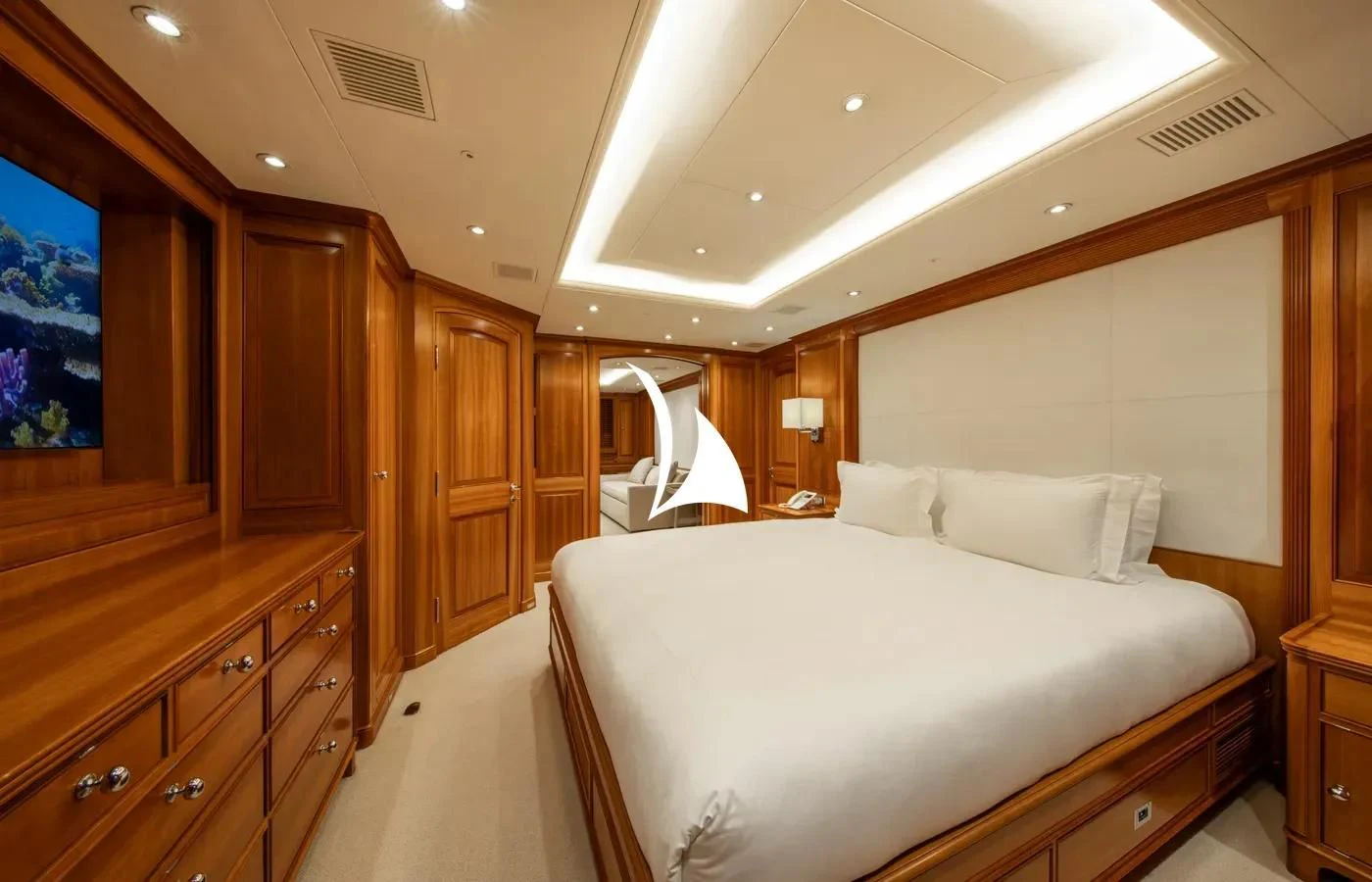 a bedroom with a bed and cabinets aboard PERSEUS Yacht for Sale