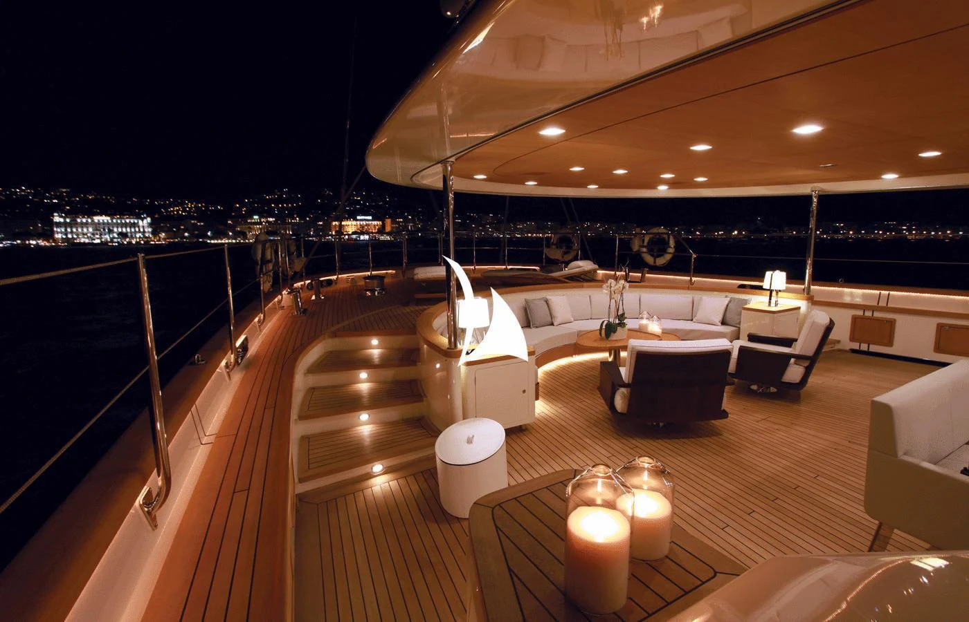 a room with a view of a city at night aboard PERSEUS Yacht for Sale