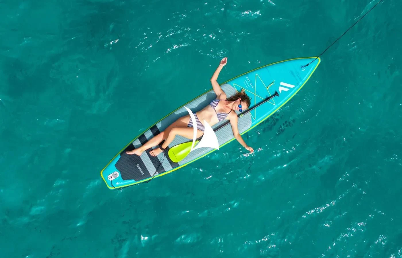 a person on a surfboard in the ocean aboard PERSEUS Yacht for Sale
