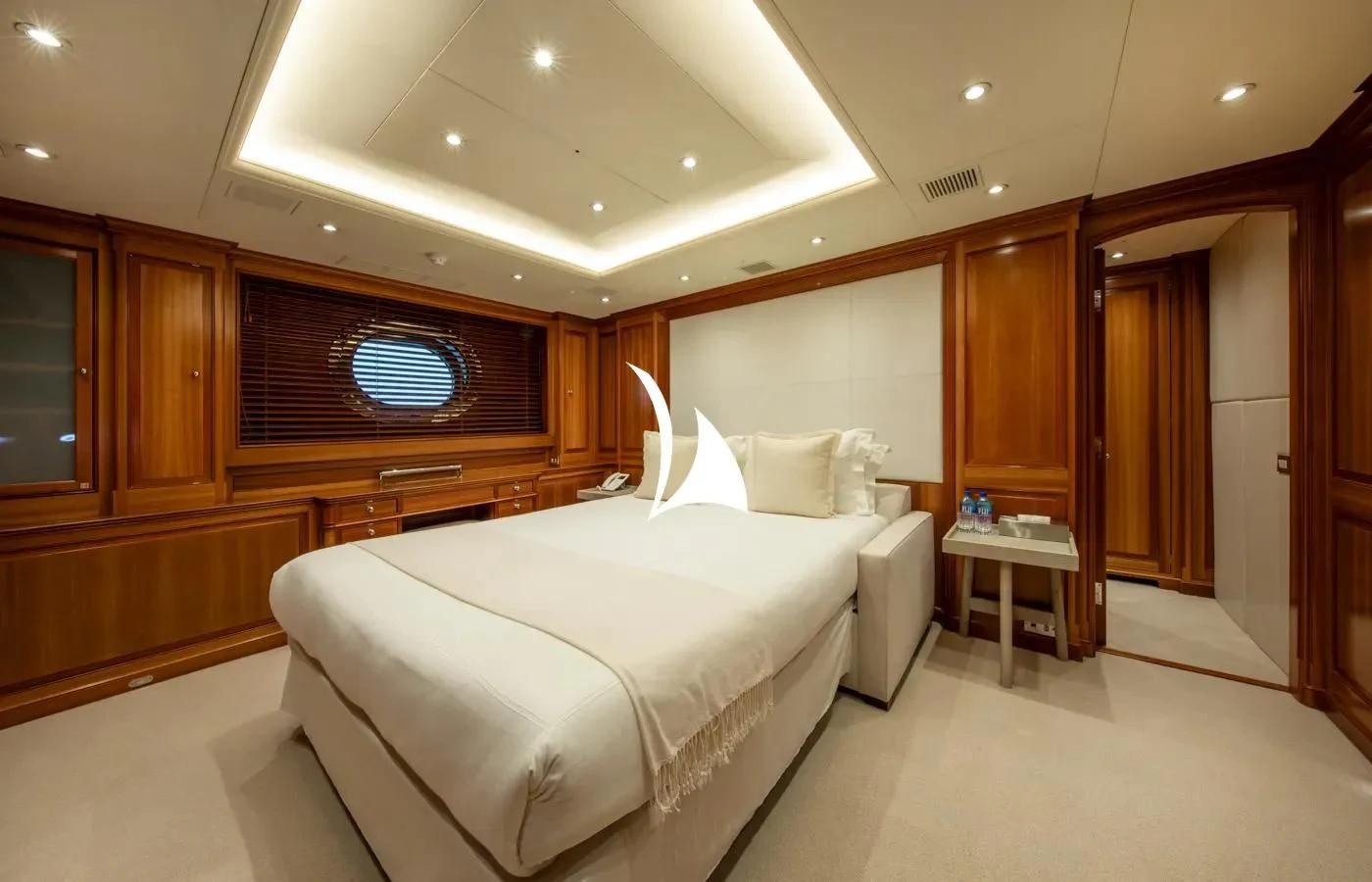a room with a bed and a desk aboard PERSEUS Yacht for Sale