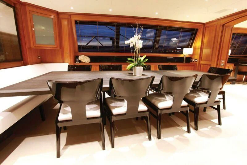 a room with a table and chairs aboard PERSEUS Yacht for Sale