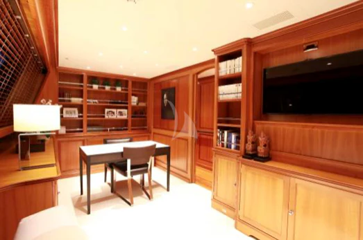 a room with a table and chairs aboard PERSEUS Yacht for Sale