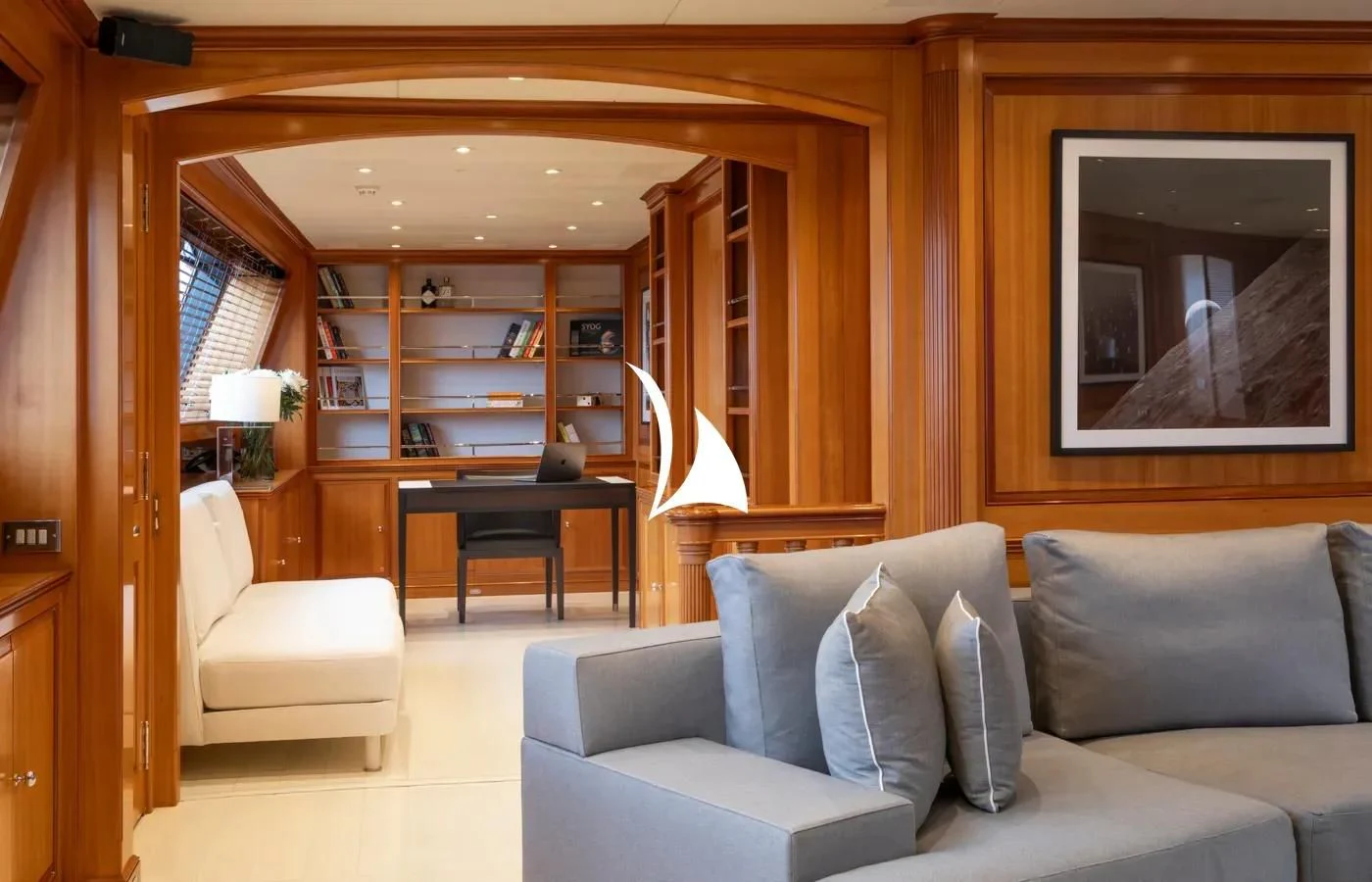 a living room with a large mirror aboard PERSEUS Yacht for Sale